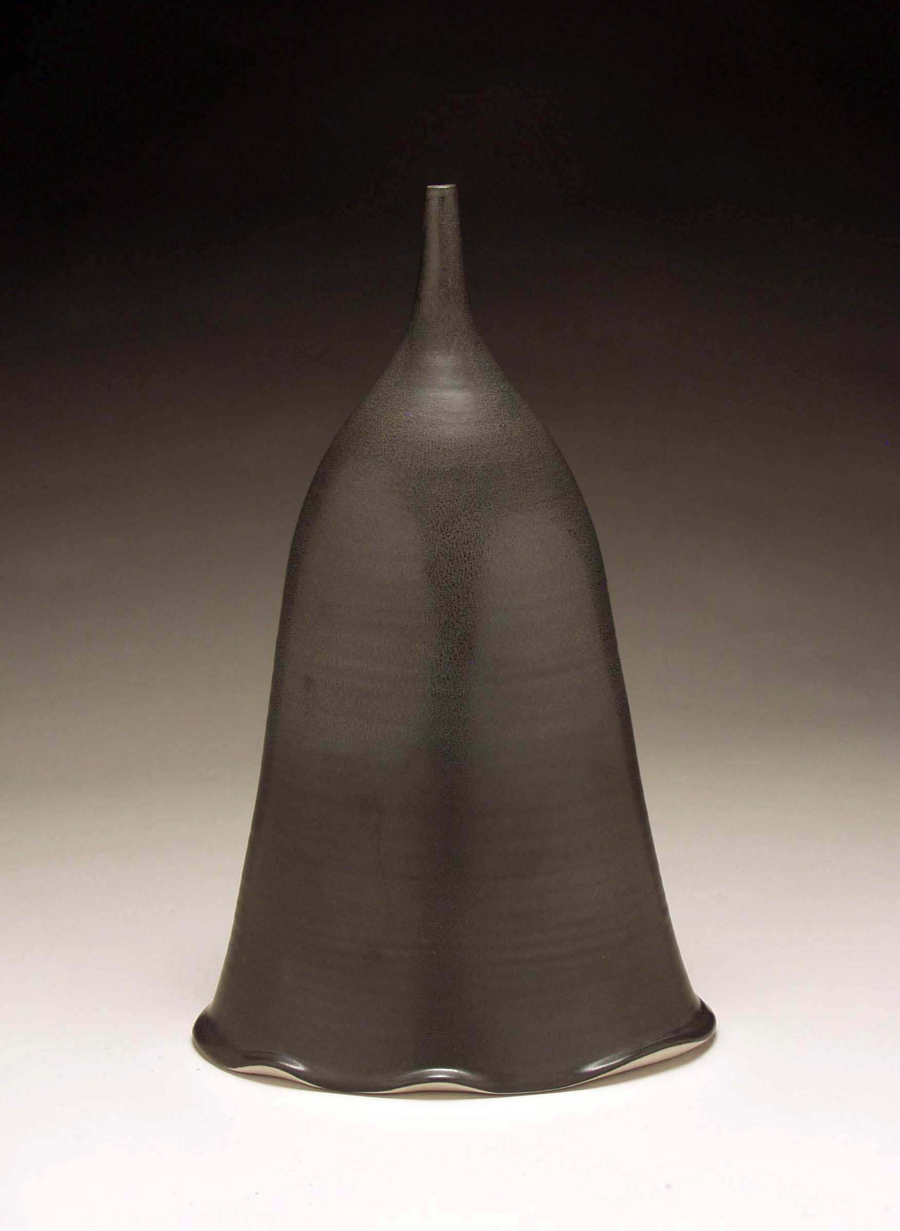 conner burns -  black oval bottle